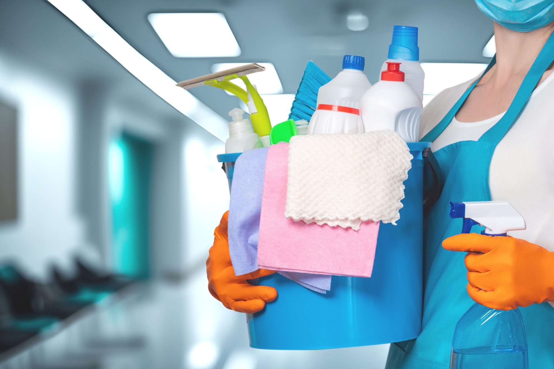 Cleaning supplies prepare for a deep clean in a hospital corridor.